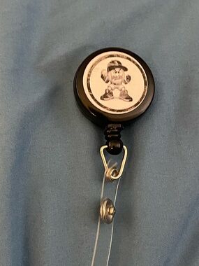 Black Badge Reel with Mascot Graphic